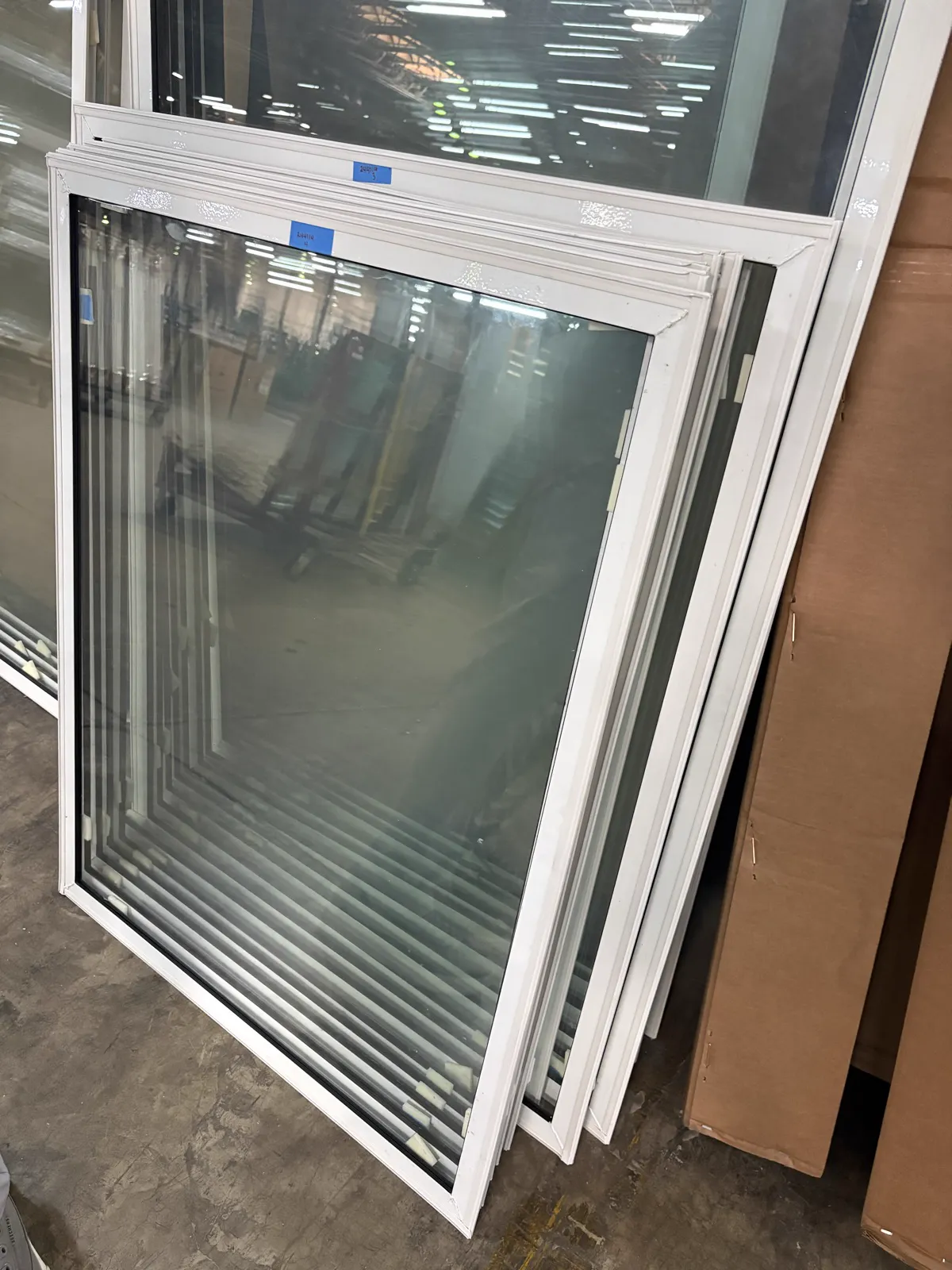 Actual fixed picture storm window panels during production