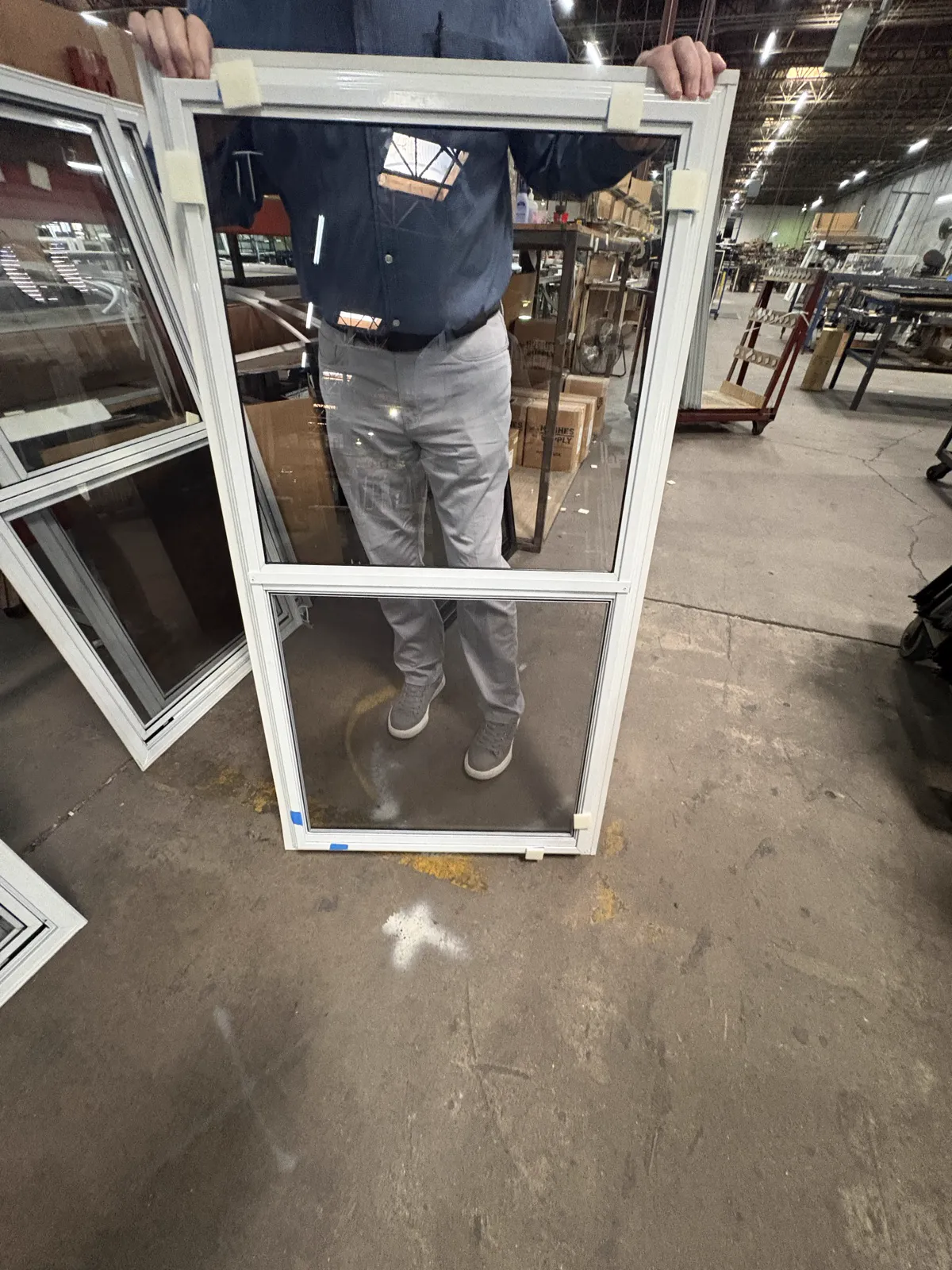 Actual white vertical two-track storm window viewed from the front