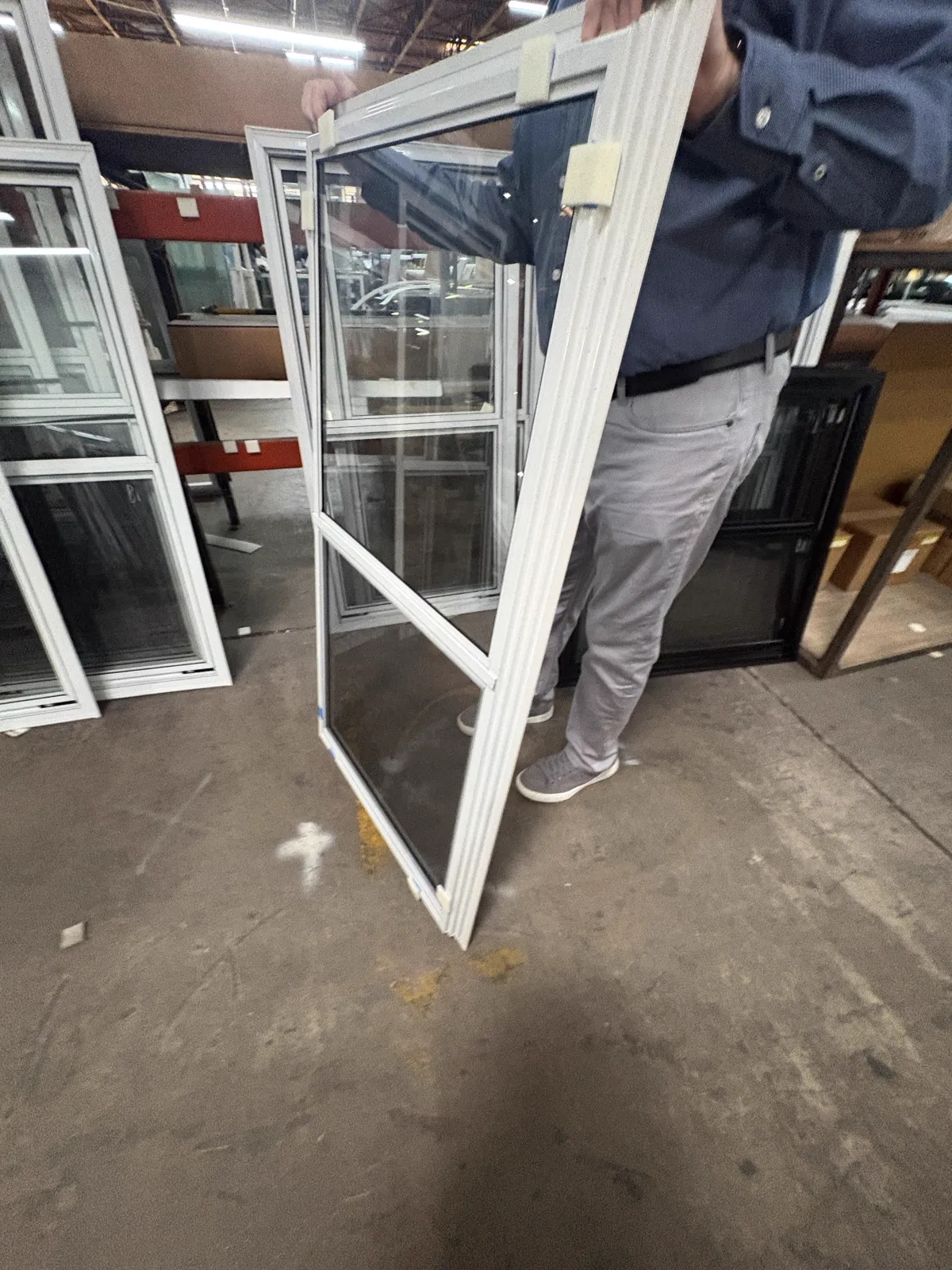 Actual white vertical two-track storm window frame and screen profile