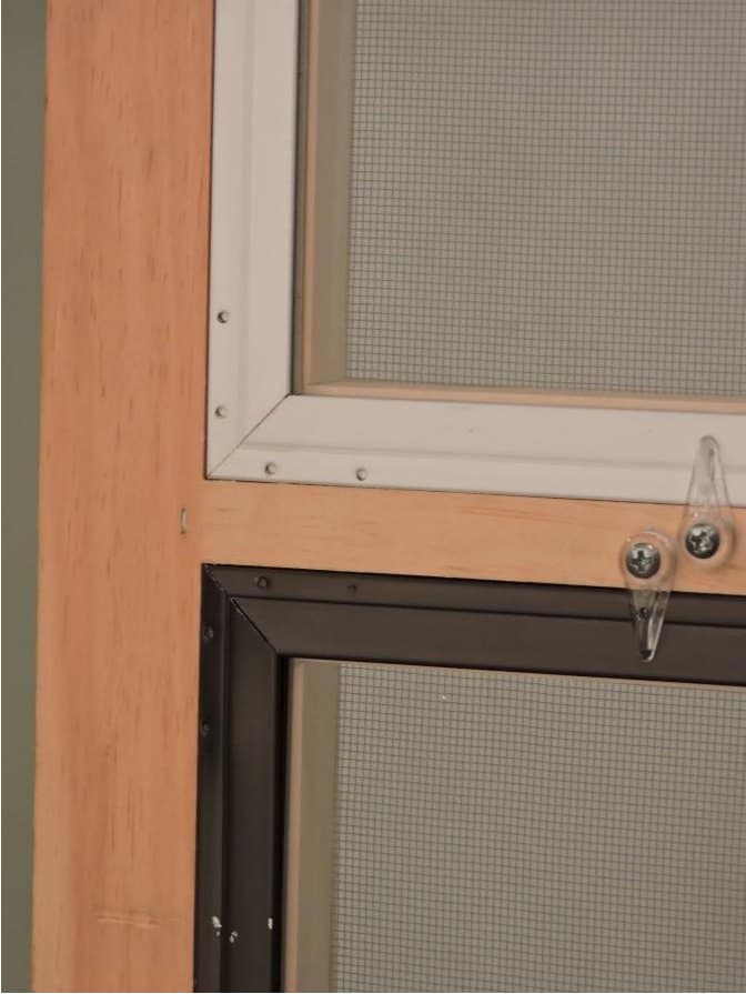 Combination wood storm window center bar with storm inserts, interior