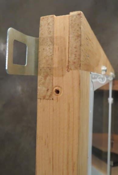 Mortise-and-tenon joint on a wood storm window stile, side view
