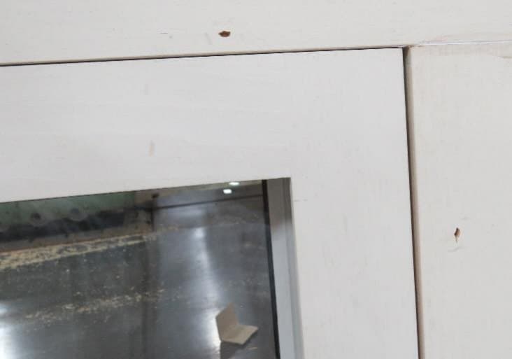 Fit detail of an installed self-storing wood storm window