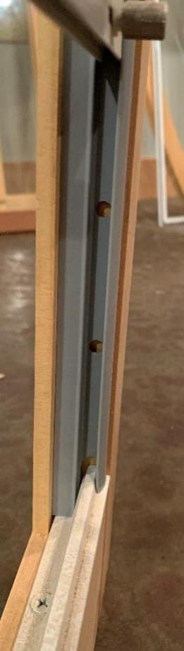Track system of a self-storing wood storm window