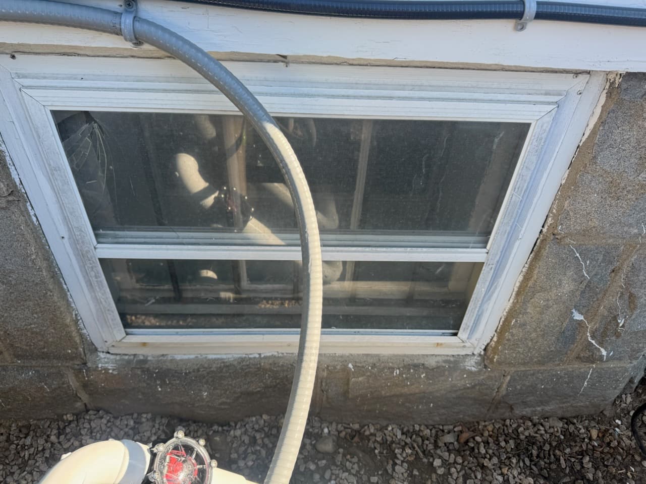 Basement window opening before the storm window installation