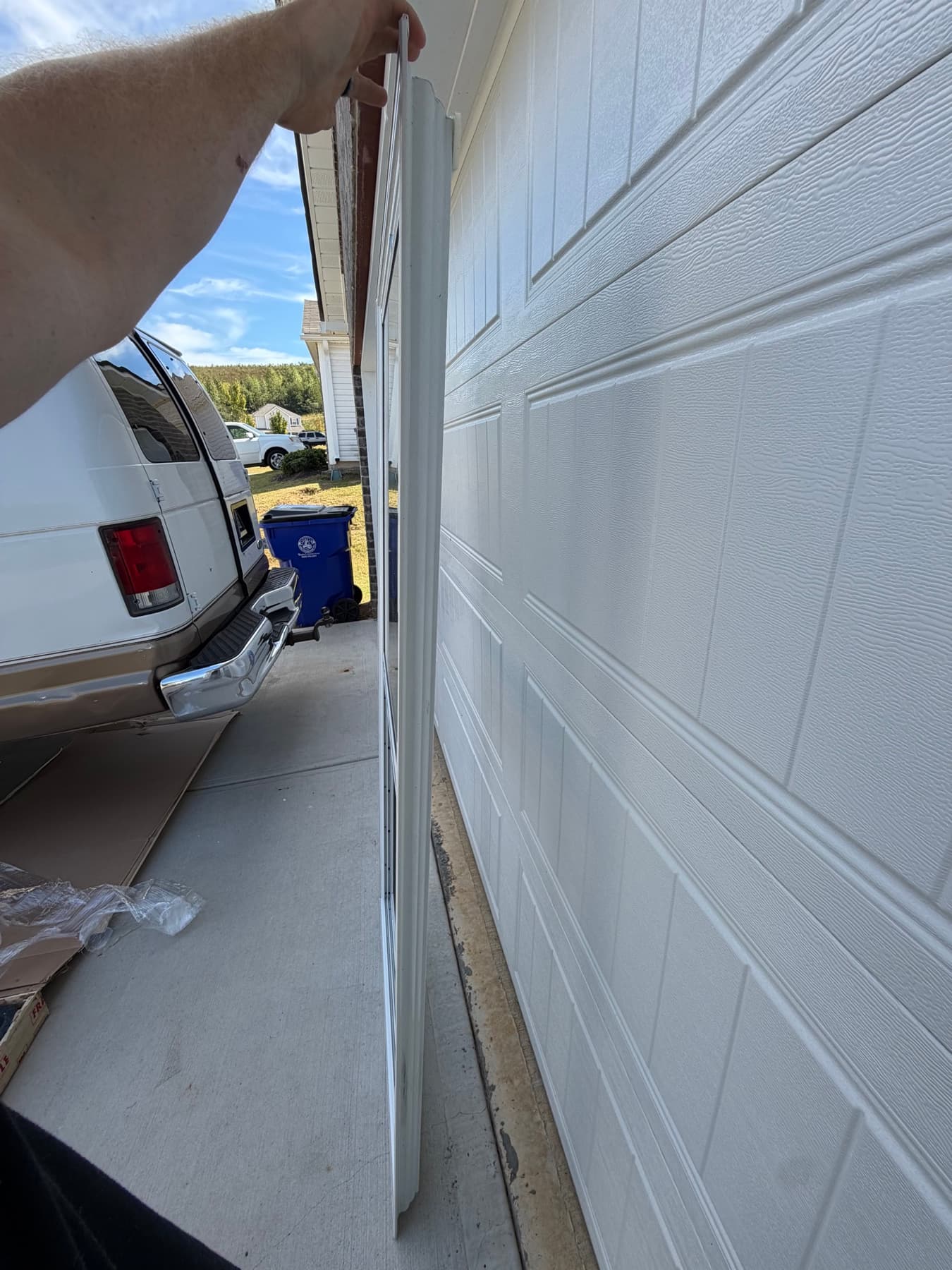 Second side profile view of the delivered storm door