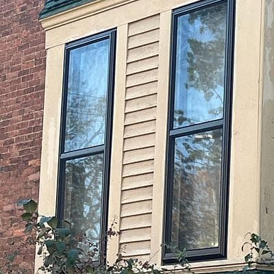 Two black storm windows installed at Tom’s Ohio home